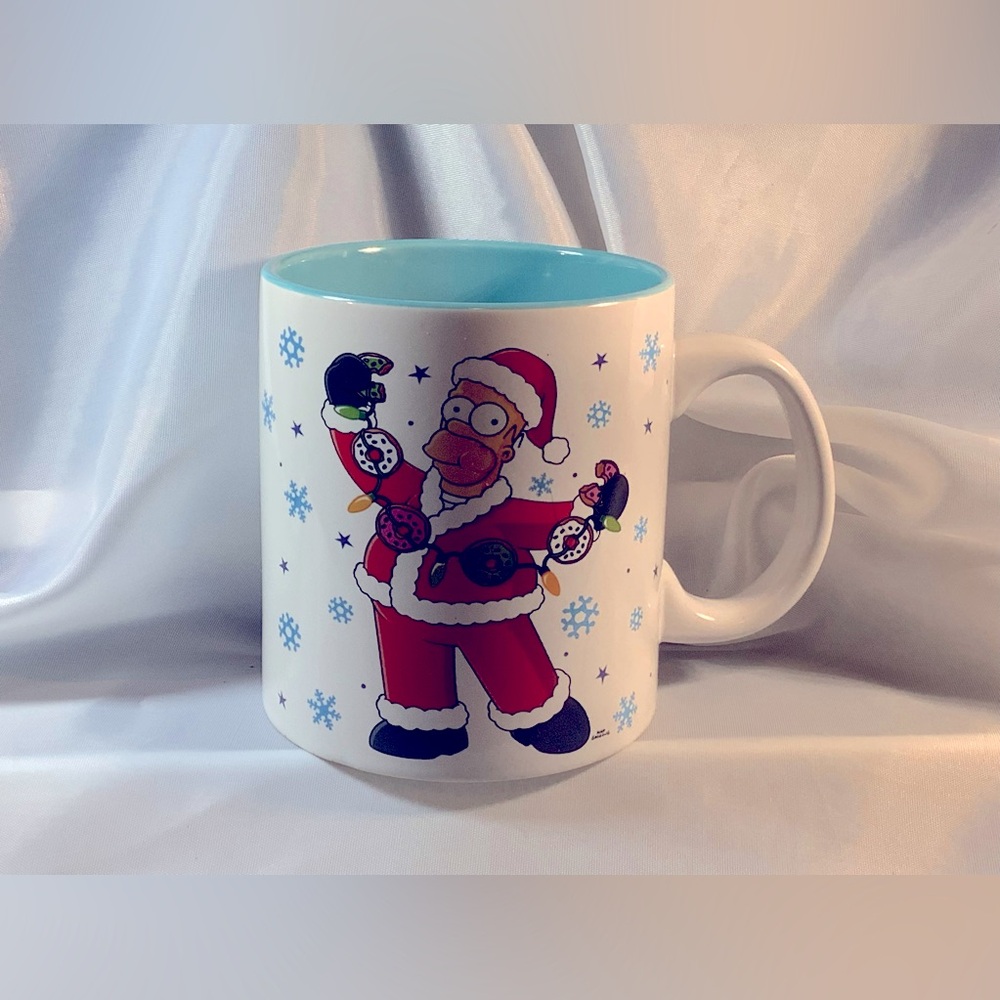A Homer Simpson Santa “D’Oh Ho-Ho!” Coffee Mug.